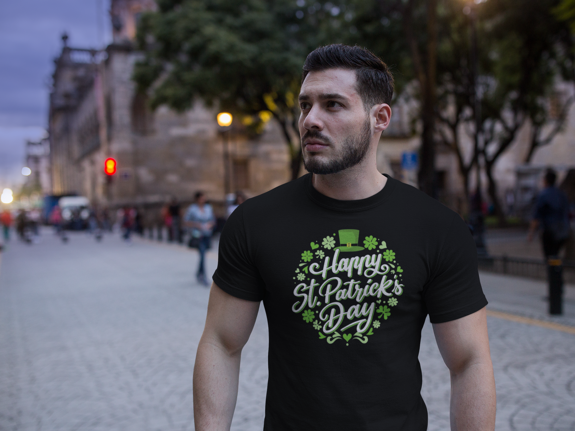 Man wearing a black t-shirt with 'Happy St. Patrick's Day' design on a city street.