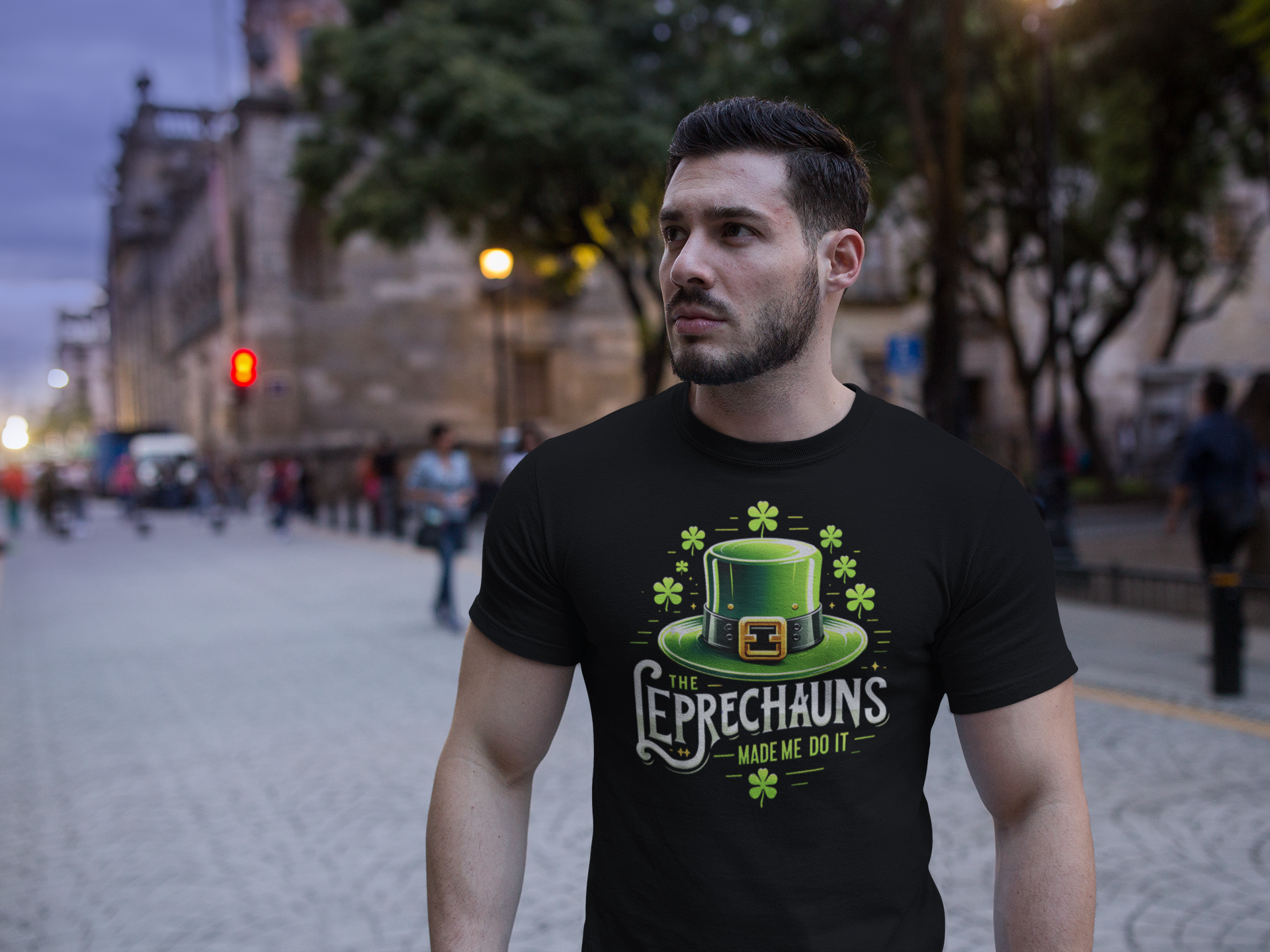 Man wearing a black t-shirt with a green leprechaun hat graphic and text in an urban setting.